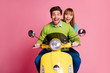 © deagreez - Photo of funny excited lady guy couple driving sitting speed good mood vintage yellow moped cool vacation wear casual jumper isolated pink color background