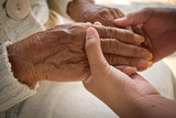 Fototapeta  -  Hand of a woman looking after the elderly