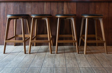Row Of Wooden Chairs Or Stools Vintage In Front Of Counter Bar Interior Retro Style Decoration