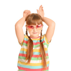 Wall Mural - Funny little girl with sunglasses on white background