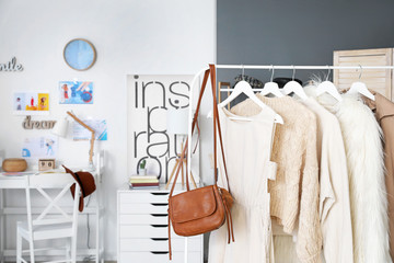 Wall Mural - Rack with stylish female clothes in dressing room