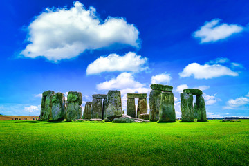 Fototapete - Stonehenge an ancient prehistoric stone monument on blue sky background at Wiltshire, UK.