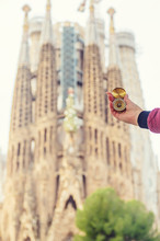 Sagrada Familia Barcelona With A Compass In Hand. Selective Focus.