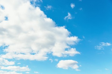 Wall Mural - Blue sky background. Blue sky with fluffy white clouds. Copy space