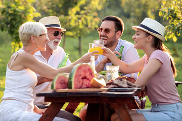 Family having lunch at summer garden party