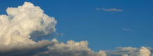 Panorama Image, Fluffy White Cloud Above Clear Blue Sky Background