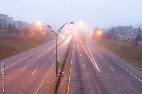 Fotografía Colorful light traces of busy night traffic on highway