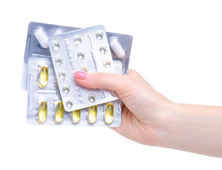 Sticker - blister pills capsules in hand medicine and pharmacy on white background isolation