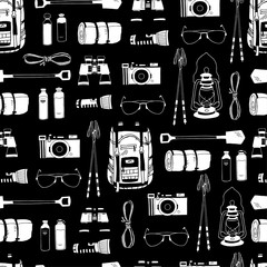 Wall Mural - Monochrome vector seamless pattern with white objects isolated on black. Endless texture. Backpack, rolled camping bed, reusable bottles, flashlight, binoculars, camera, sunglasses, trekking sticks.