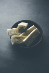 Sticker - Pootharekulu  is a popular recipe originated from Andhra Pradesh, India.It is a paper-thin sweet or dessert made from rice start/gram flour, jaggery/sugar and clarified butter. Served in a plate.