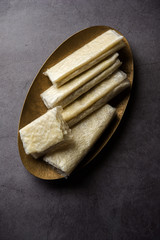 Sticker - Pootharekulu  is a popular recipe originated from Andhra Pradesh, India.It is a paper-thin sweet or dessert made from rice start/gram flour, jaggery/sugar and clarified butter. Served in a plate.