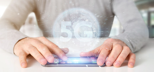 Poster - Businessman holding a 5G connection with data surrounding - 3d rendering