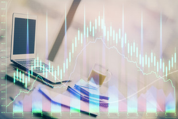 Forex Chart hologram on table with computer background. Double exposure. Concept of financial markets.