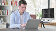 © stockbakers - Busy Young Man Working on Laptop