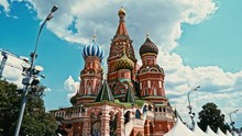 Close Up Shot Of St Basil's Cathedral With Bright Blue Skies And Construction Cranes In The Background And Street Lights In The Foreground. Concept: Old Vs New