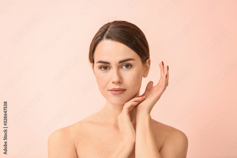 Beautiful young woman on color background. Plastic surgery concept