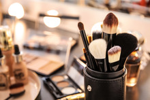 Brushes And Different Cosmetics On Table Of Makeup Artist