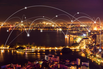 Wall Mural - Smart city and wireless communication network concept. Digital network connection lines of Hanoi city at West Lake or Ho Tay