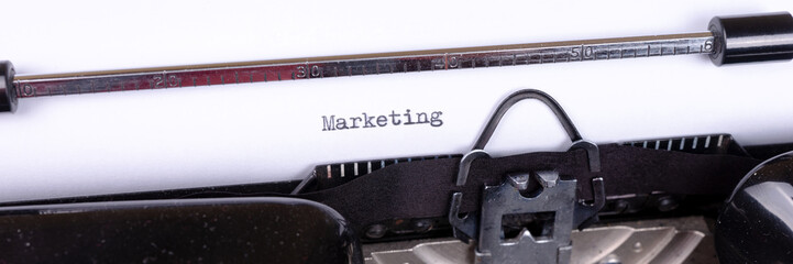 Fototapete - Marketing - written on an old black typewriter