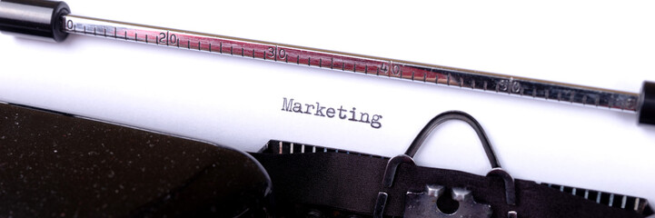 Fototapete - Marketing - written on an old black typewriter