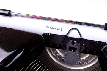 Fototapete - Marketing - written on an old black typewriter