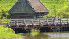Landscape Scenery Of Wooden Bridge With Rural Wooden House And Green Vegetation On A Sunny Summer Day In Lublin, Poland -wide Shot