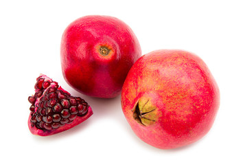 Whole and cutting ripe fresh juicy tropical POMEGRANATE fruit isolated on white background. Full dept of field. 