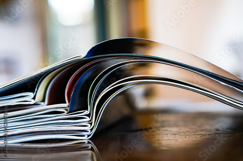 Cuadros en Lienzo Closeup background of a pile of old magazines with bending pages