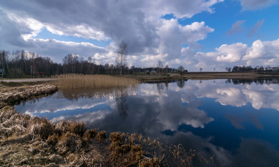 the view of the calm lake, the blue sky