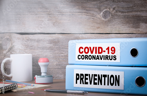 Fotomural COVID-19, CORONAVIRUS and PREVENTION. Two binders on desk