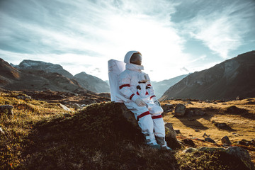 Wall Mural - astronaut exploring a new planet. searching for a new home for humanity. concept about science and n