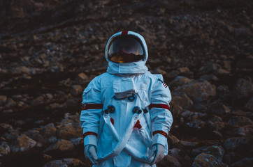 Wall Mural - astronaut exploring a new planet. searching for a new home for humanity. concept about science and n