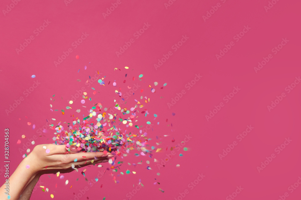 Falling confetti on bright pink background - obrazy, fototapety, plakaty 