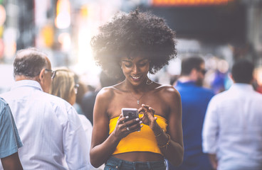 Young beautiful girl walking in Time square, manhattan. Lifestyle concepts about New york