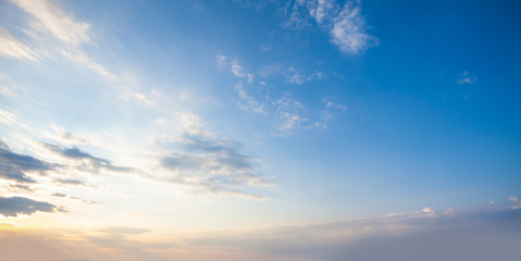 Wall Mural - blue sky clouds background. beautiful landscape with clouds and orange sun on sky