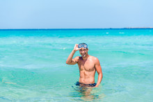 Attractive Young Caucasian Man In The Sea , Wearing Glasses. Summer Vacation Concept.