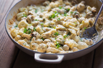 Wall Mural - Creamy chicken, mushroom, gnocchi parsley bake