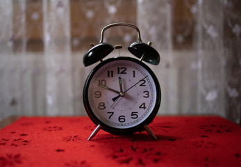 old alarm clock on the table