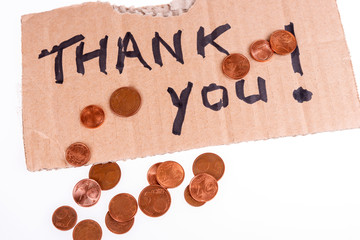 Wall Mural - Cent coins and thank you written on the cardboard