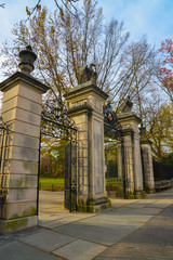 princeton, nj usa - novenber 12, 2019: stone column with eagle sculptures and wrought iron gate at t