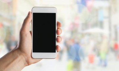 Poster - Hand holding smartphone with a blank screen