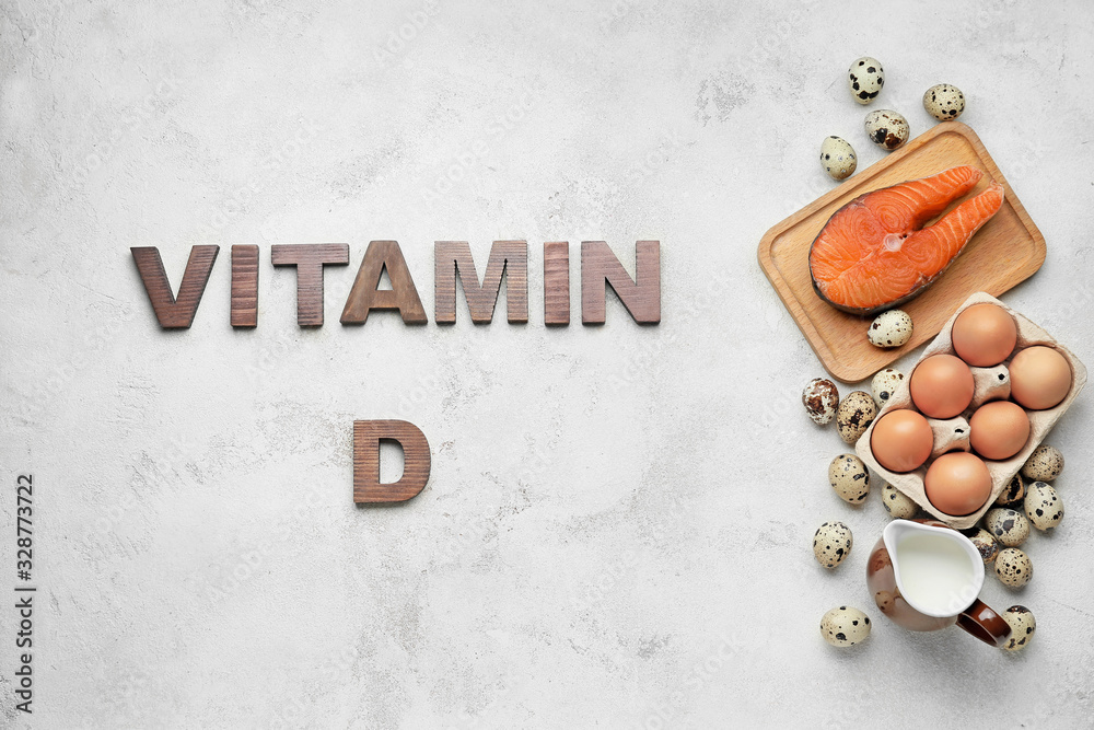 Healthy products rich in vitamin D on white background