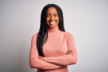 Poster - Young african american woman standing casual and cool over white isolated background happy face smiling with crossed arms looking at the camera. Positive person.