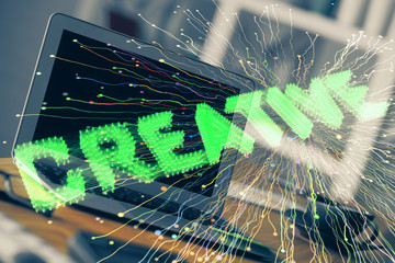 Desktop computer background in office and start up theme hologram drawing. Double exposure. Startup concept.