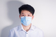 © Steve - A man wearing a disposable medical surgical mask