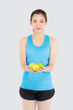 © NT_studio - Beautiful portrait young asian woman in sport clothing with satisfied and holding green apple isolated on white background, girl asia have shape and wellness, exercise for fit with health concept.