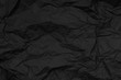 Black dark crumpled paper blank texture background