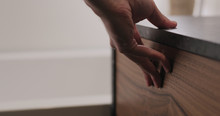 Man Hand Open And Close Batroom Cabinet Drawer Closeup