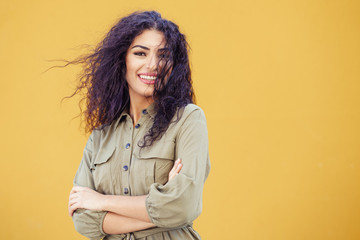 Young Arab Woman with curly hair outdoors