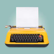 Yellow Typewriter On Blue